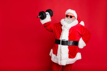 Portrait of his he nice attractive fat overweighed bearded Santa working out barbell physical...