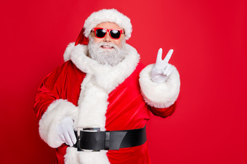 Close-up portrait of his he cheerful cheery optimistic funky fat overweight plump gray-haired bearded man showing v-sign isolated over bright vivid shine red background