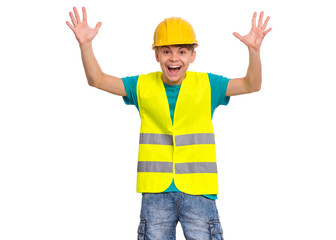 Funny Handsome Teen Boy wearing Safety Jacket and yellow Hard Hat having fun. Portrait of Happy smiling Child with outstretched hands Looking at camera, isolated on white background.