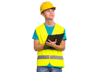 Handsome Teen Boy wearing Safety Jacket and yellow Hard Hat with Clipboard on hands. Portrait of Child - young technician with clipboard in hands taking necessary notes, isolated on white background.