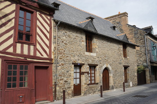 old stone and half timber red house in a small village in France