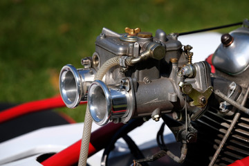 Sports carburettor on racing motorcycle combination.
