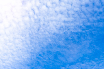 Fototapeta na wymiar White Clouds over Blue Sky Background