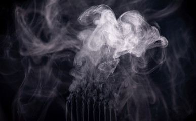Abstract smoke on a dark background . Isolated .