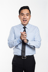 Asian man in work attire looking very happy