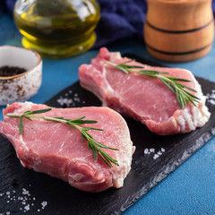 Raw pork chop steak ready to cook. Closeup