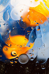 Yellow-blue abstract background from oil on the surface of the water