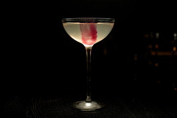 Darkened close-up of alcohol cocktail on the counter