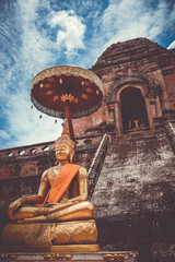 Gold Buddha, Wat Chedi Luang temple big Stupa, Chiang Mai, Thailand