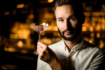 Portrait of the bartender with an alcohol cocktail