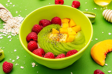 Oatmeal bowl with fresh berries and fruits