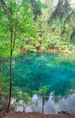 Fototapeta premium Mystically turquoise coloured spring Kiikunlahde in Hollola, Finland