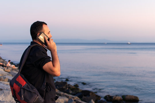 Turkish Man Is Talking By Phone On Seafront In Istanbul