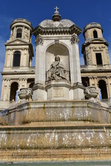 View of Church of Saint Sulpice neoclassical facade from fountain. Paris, France.