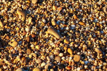 sea pebbles colored granite on the beach