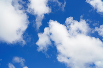 Blue sky and white clouds background.