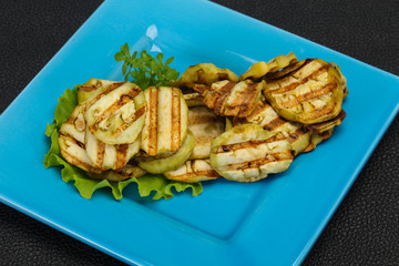 Grilled eggplant slices served basil