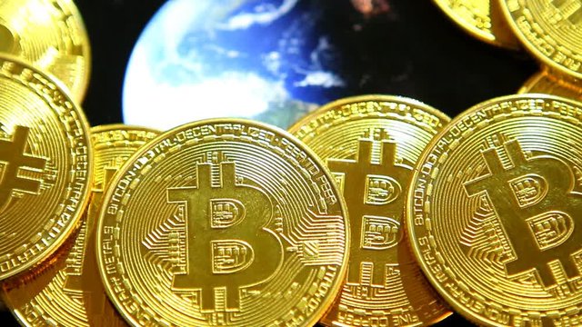 Bit coin with world globe rotating in studio, Chiangmai Thailand