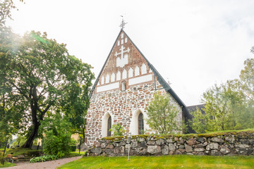 Fototapeta premium Hollola, Finland - 9 September 2019: Old medieval stone church of St. Mary in Hollola, Finland