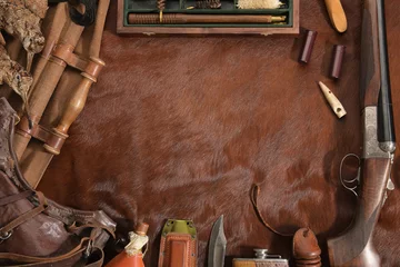 Fototapeten Hunting concept with woodcock, shotgun, knife and ammunition for hunting arranged on brown background. © glenkar