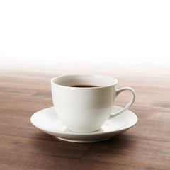 cup of coffee on wooden table