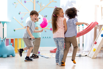 Children running and playing games in day care