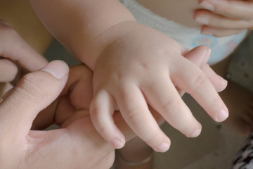 hands of mother and baby