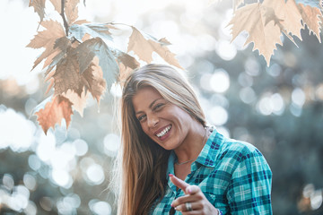 Young woman enjoying in autumn colored nature.
