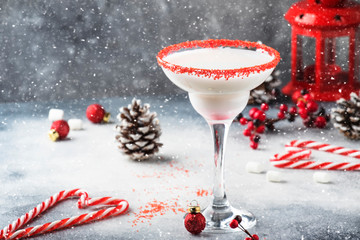 Snow daiquiri, Christmas or New Year alcoholic cocktail with rum and cream with red decor in...