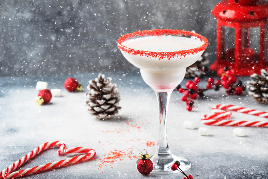 Snow daiquiri, Christmas or New Year alcoholic cocktail with rum and cream with red decor in festive setting, copy space