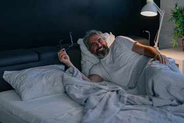 Waiting for his wife to kiss for a good night