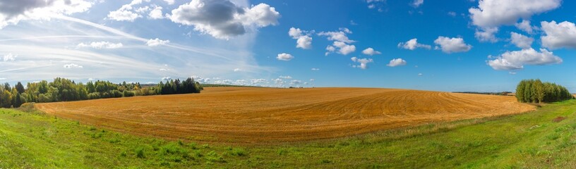 Panorama of the field after harvesting grain. Zavyalovsky district, Udmurt Republic, Russia.