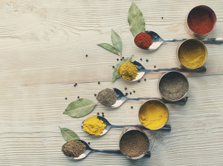 Fototapeta na wymiar spices on a wooden light background photo