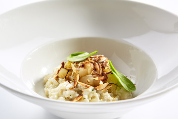 Risotto with roasted pear and almond closeup