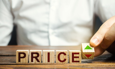 A man changes the position of a block with symbols of growth and decline near the word Price. Price...