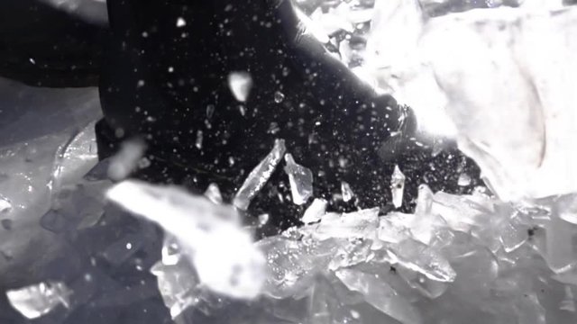 Ultra slow motion of a boot that breaks on the ice