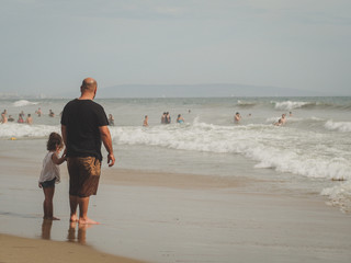 Dad with daughter at beach