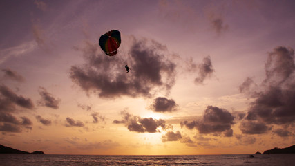 Parasailing in the sunset sky, Patong beach, Phuket, Thailand