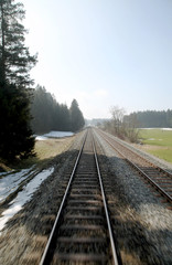 Fototapeta premium BAYERN, Germany, Blick aus einem fahrenden Zug auf die Gleise im Winter