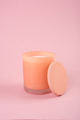 Candle in orange glass with lid studio shot mock-up