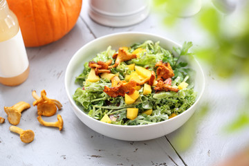 Autumn salad. Green pumpkin salad with marinated chanterelles.