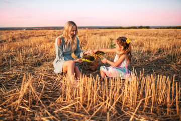 Charming young mother and pretty daughter