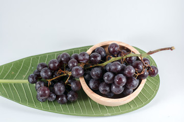 glass of pomegranate juice and cherries isolated on white background