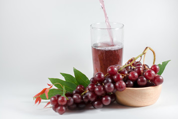 glass of pomegranate juice and cherries isolated on white background
