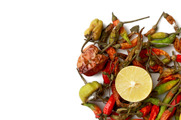 green and red dried chilies with lemon for food isolated on white background