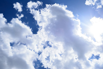 Contrasting blue sky with thick white clouds. Natural background