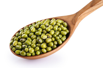 Wooden spoon with mung beans isolated on white background.