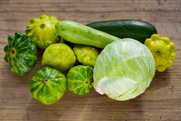 group of different varieties of squash and cabbage