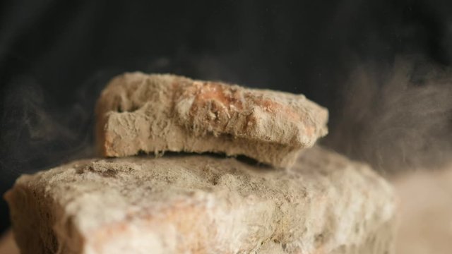 slice of bread falling on moldy bread, particles of mold slow motion, swirl, floating
