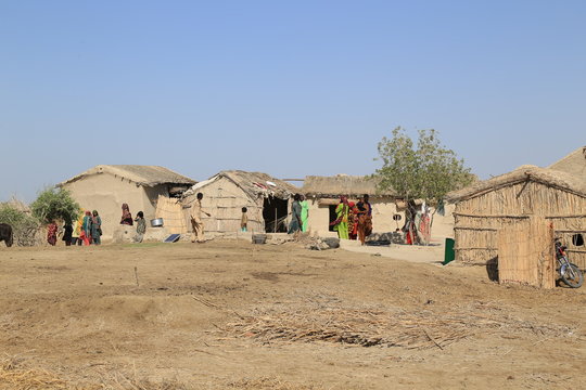 Thatta, Pakistan - April, 2018 : Sea Erosion in Keti Bandar Area of Thatta Sindh, Boats Fisher Man in Sea, Poor Huts Condition of People 
